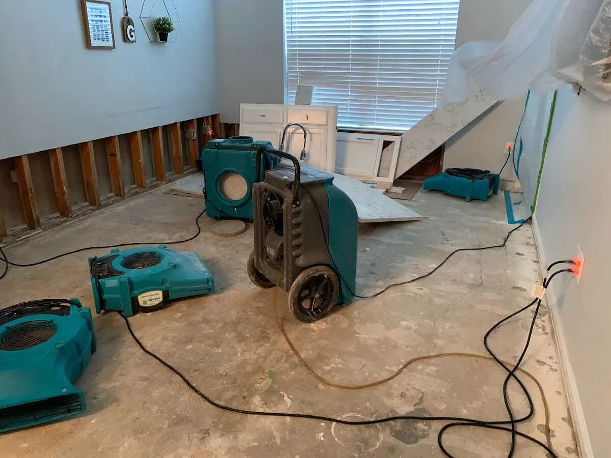 Dehumidifier in flood-cut room for Water Damage Restoration in Webster